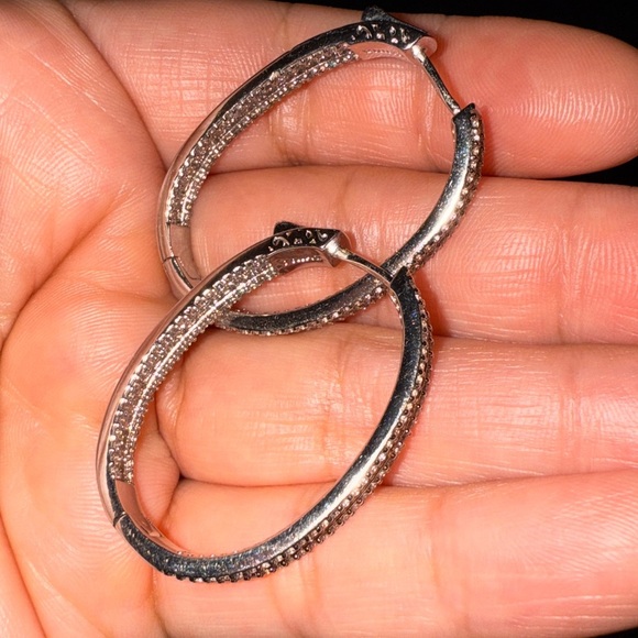 Elegant – These sparkling hoop earrings have a refined and sophisticated look. - Picture 10 of 14